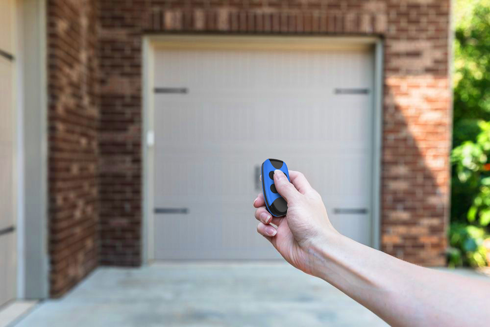 How do you program a multi-frequency garage door remote to work with your garage door opener?